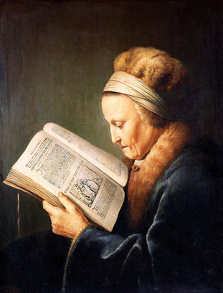 Portrait of an old woman reading